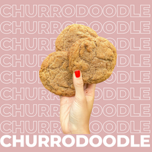Load image into Gallery viewer, Three Churrodoodle Cookies being held up by model.
