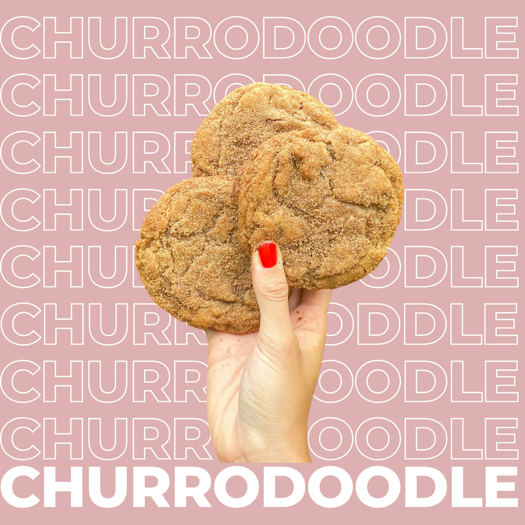 Three Churrodoodle Cookies being held up by model.