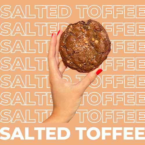 The Salted Toffee Chocolate Cookie being held up by model.