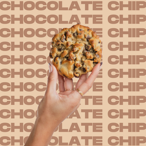 The Chocolate Chip Cookie held up in model's hand.